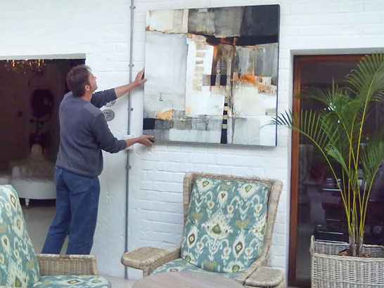Peter Pharoah hanging The 5th Element at the Turbine Hotel Art Gallery on Thesen Island in Knysna